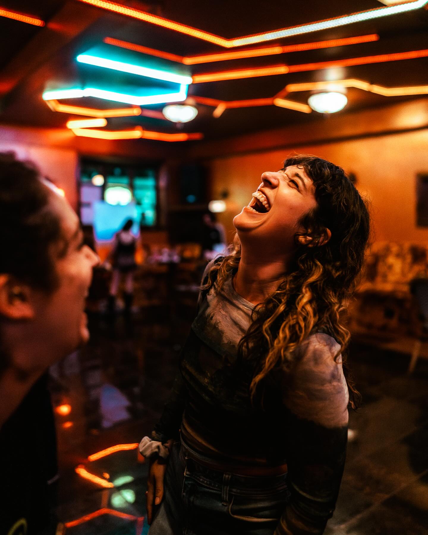 Guests laughing on the dance floor at Sip Haus Red River Austin