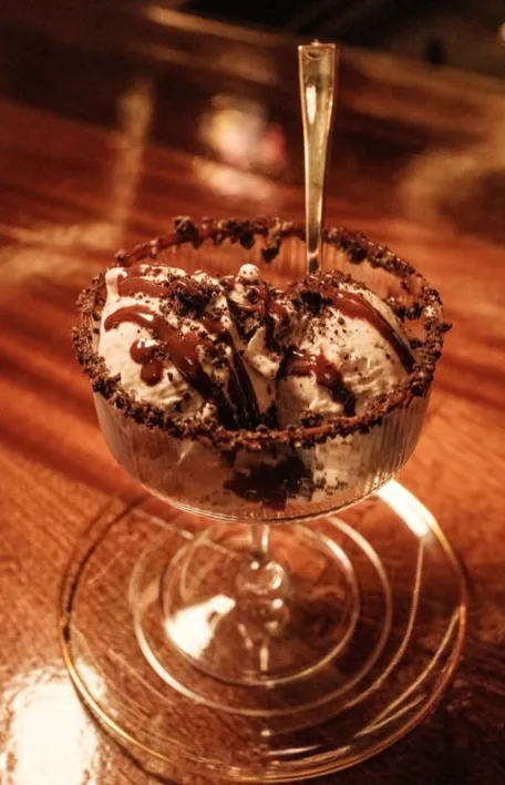 Gelato topped with chocolate and cookie crumbs at Sip Haus