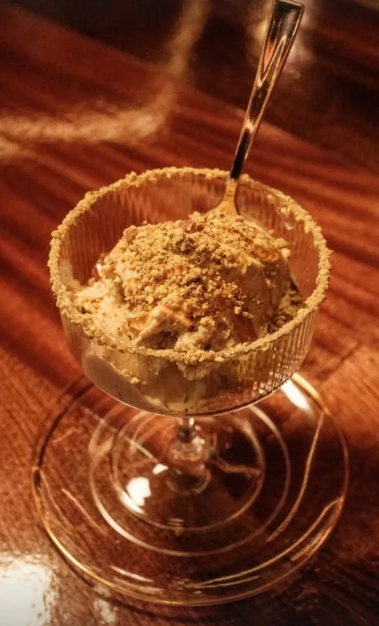 Gelato with a crumble rim in a coupe glass at Sip Haus