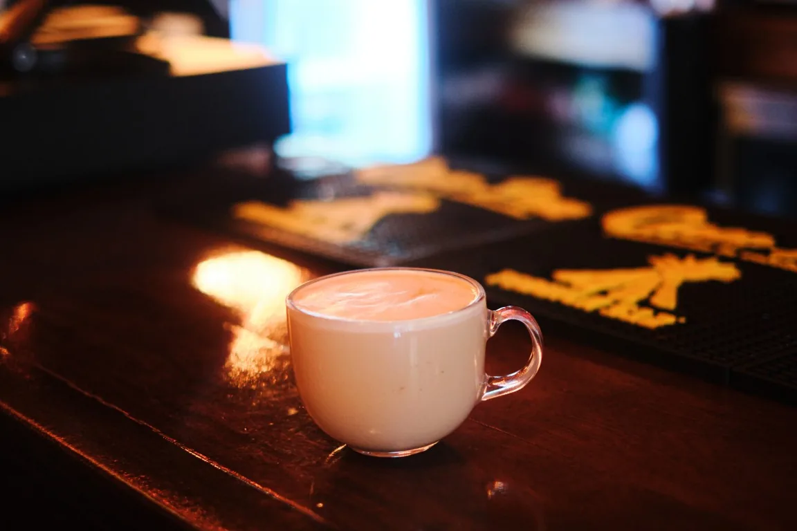 Latte in a glass cup on the bar