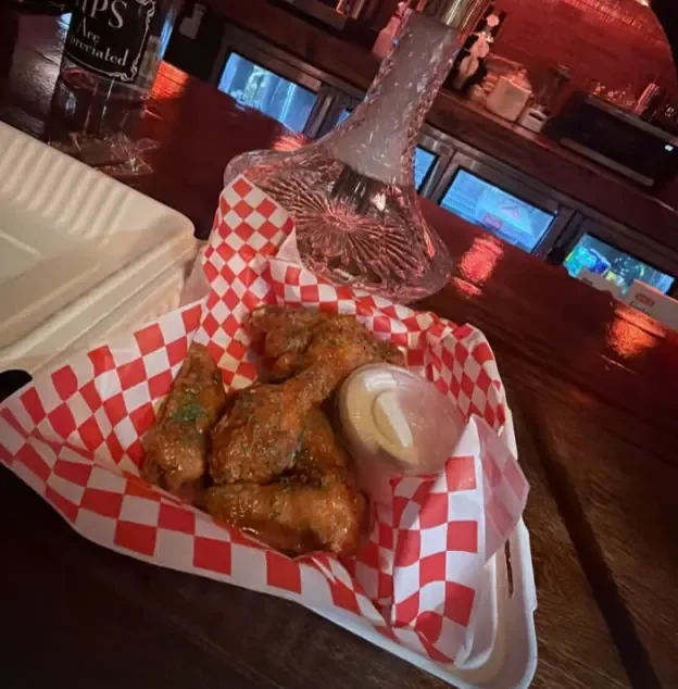 Basket of Sip Haus wings with ranch at the bar